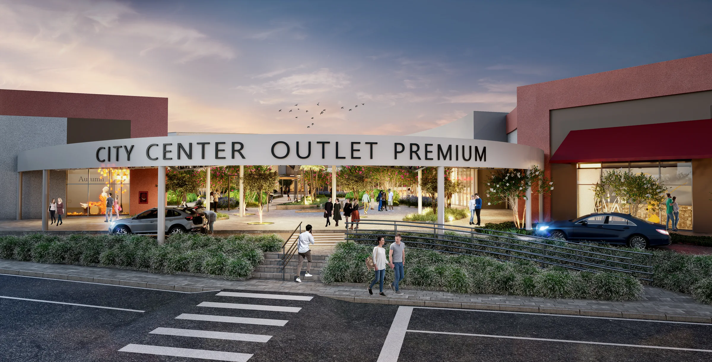 Fachada e letreiro do City Center Outlet Premium ao entardecer, vista inteira